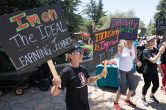 People cheering with signs